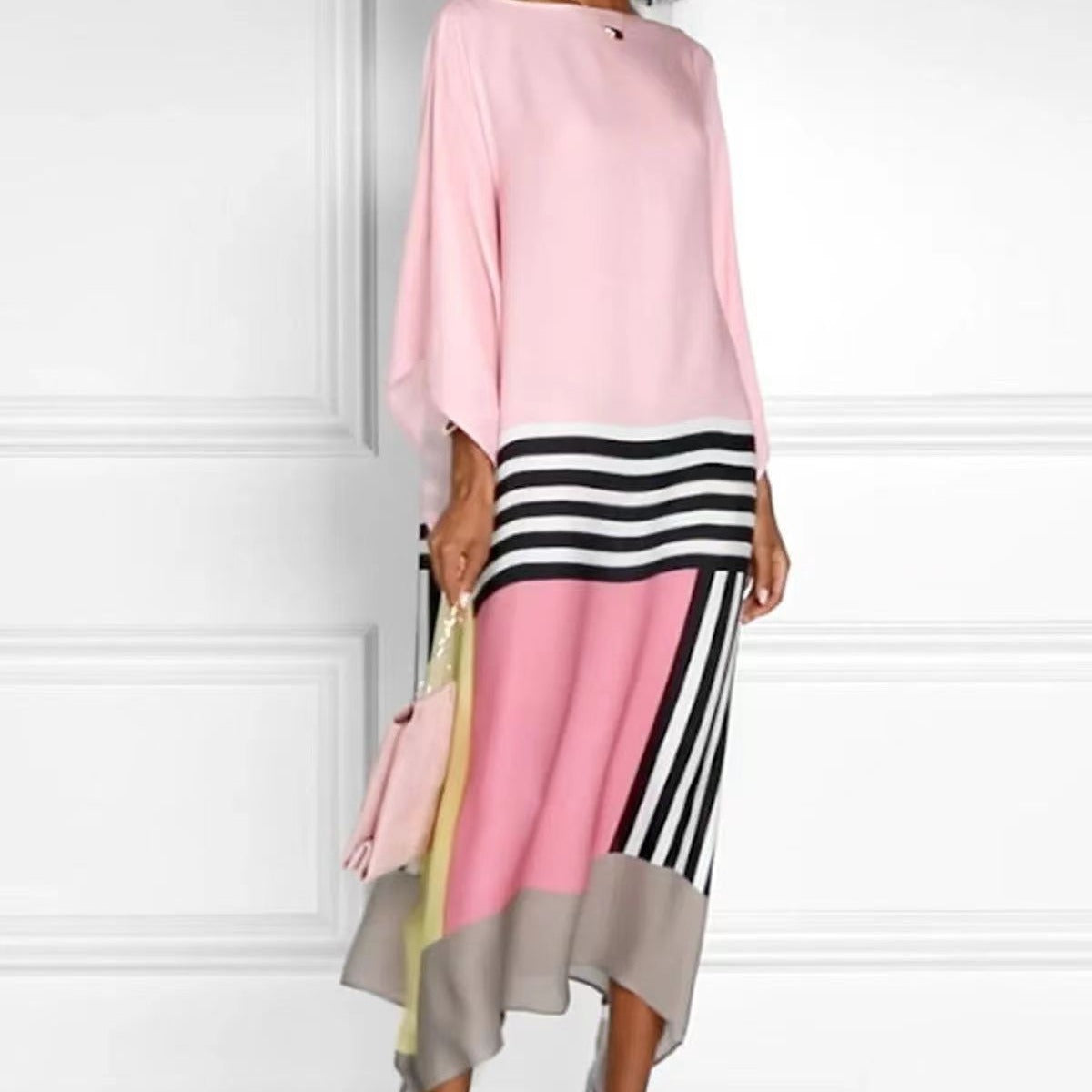 women's pink dress with black & white stripes and gray bottom