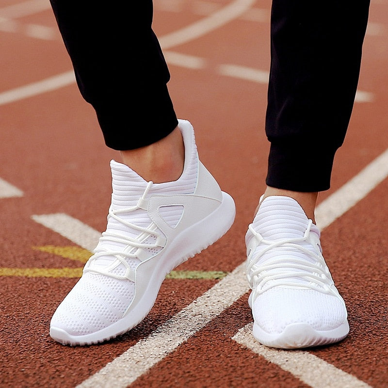 white athletic running shoes