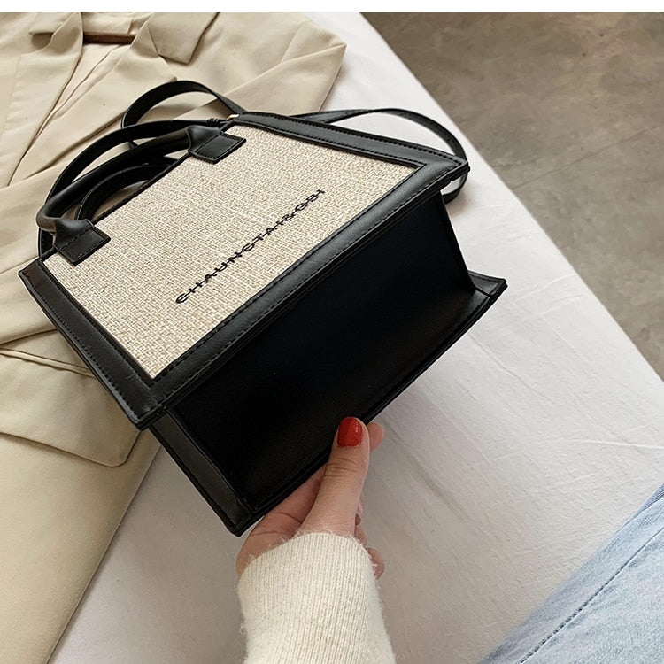 black trim natural beige small luxury handbag