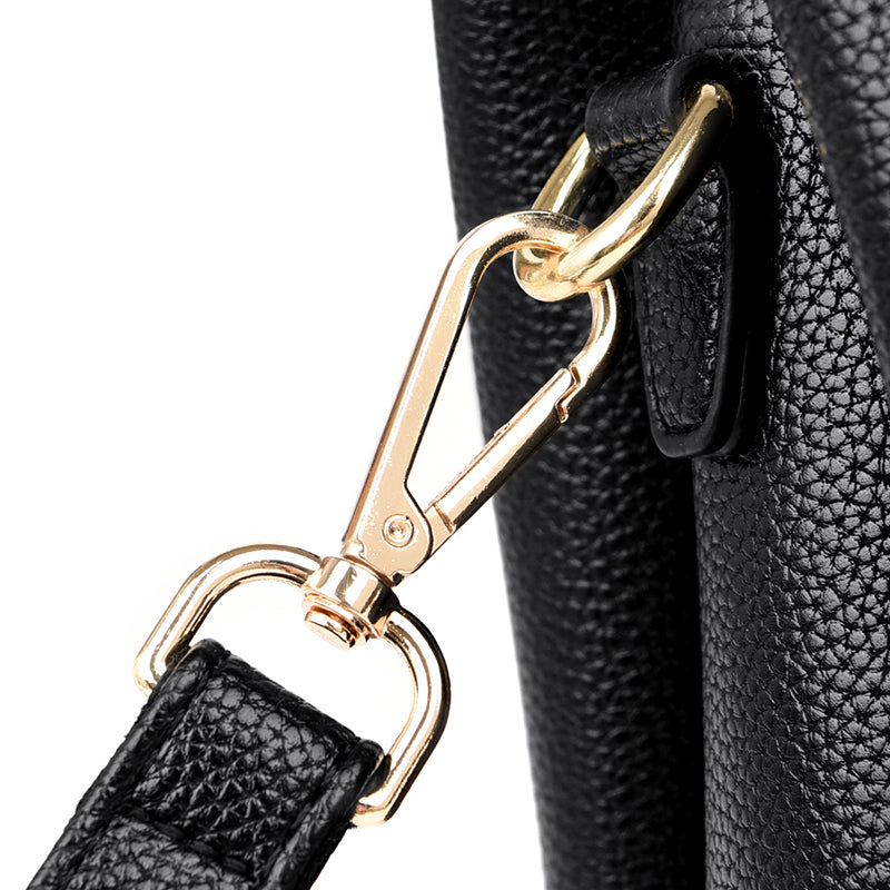 gold clasp black leather handbag