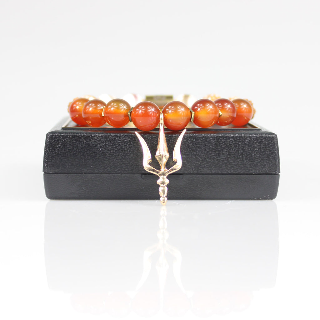 gold shiva trident trishula charm orange carnelian tigerskin rudraksha bead bracelet