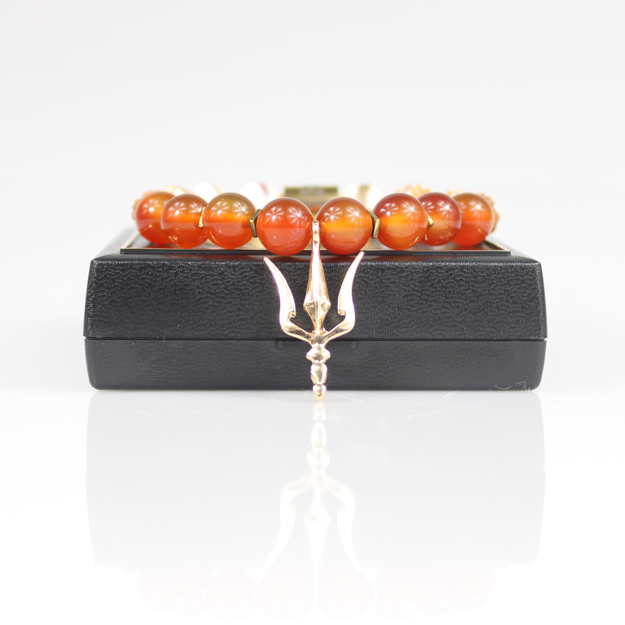 gold shiva trident trishula charm orange carnelian tigerskin rudraksha bead bracelet