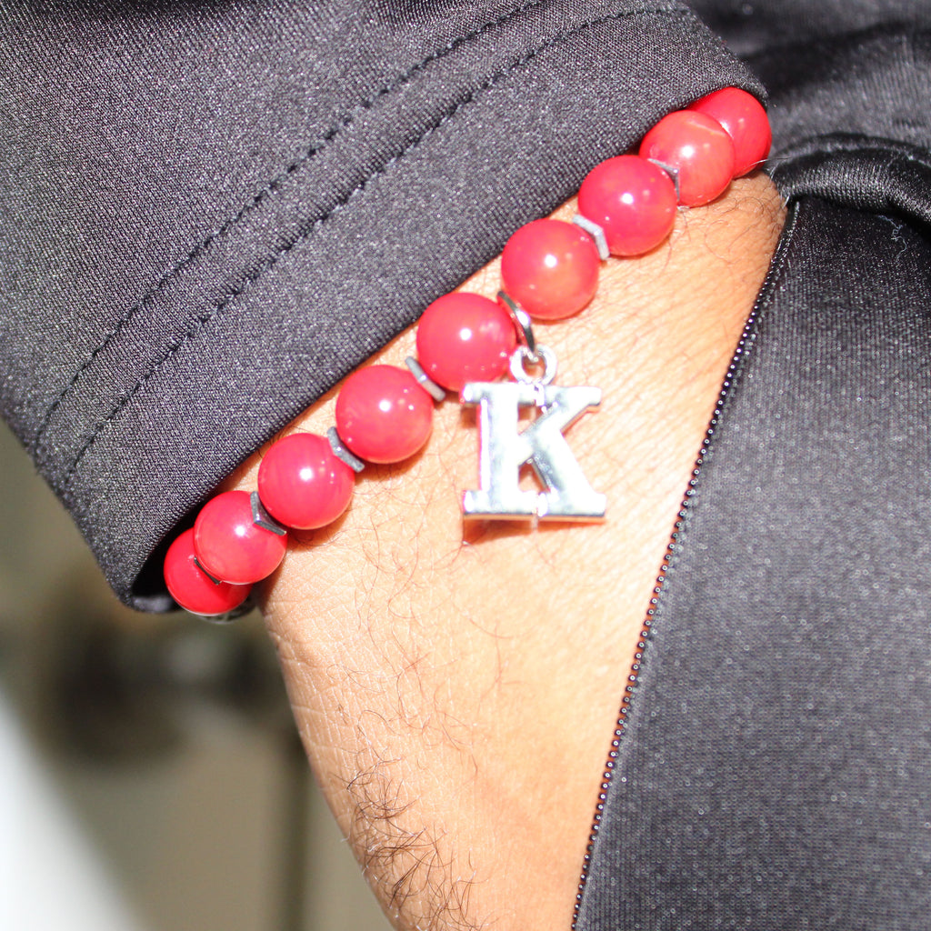 kappa alpha psi greek letter charm bead bracelet on arm