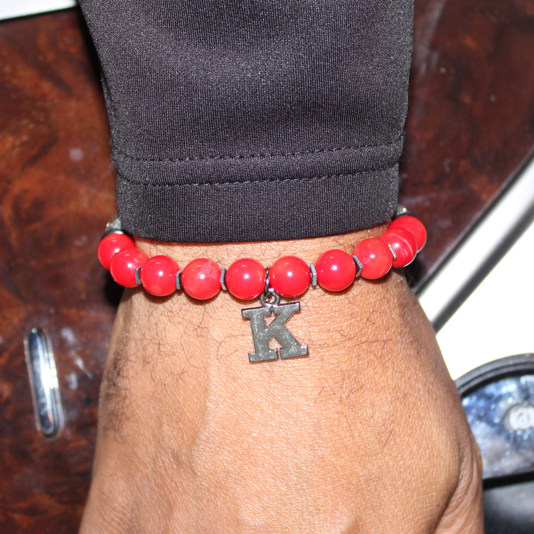 kappa alpha psi greek letter charm bead bracelet on wrist