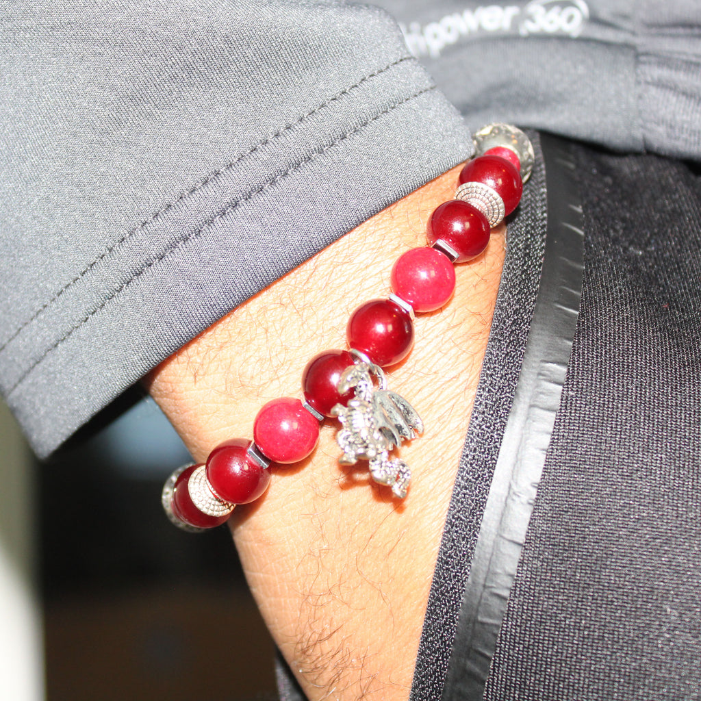 silver dragon charm red bead bracelet on wrist