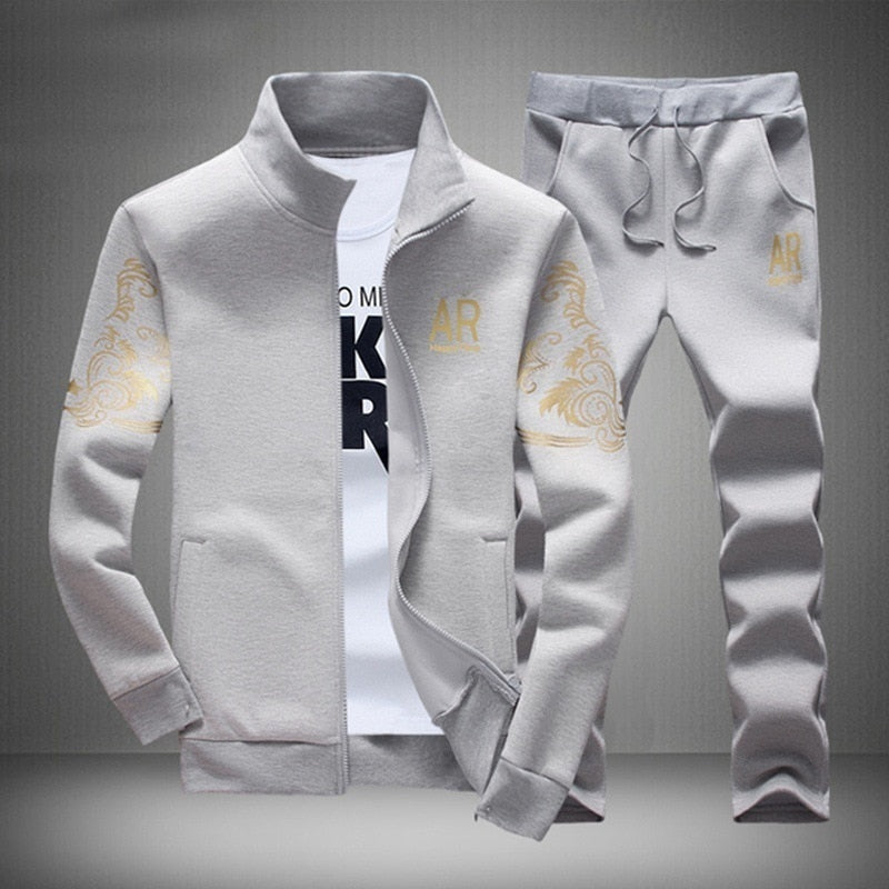 light gray and gold track suit jogger