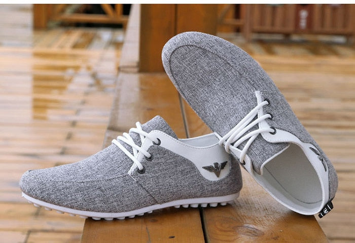 gray white low canvas casual shoes