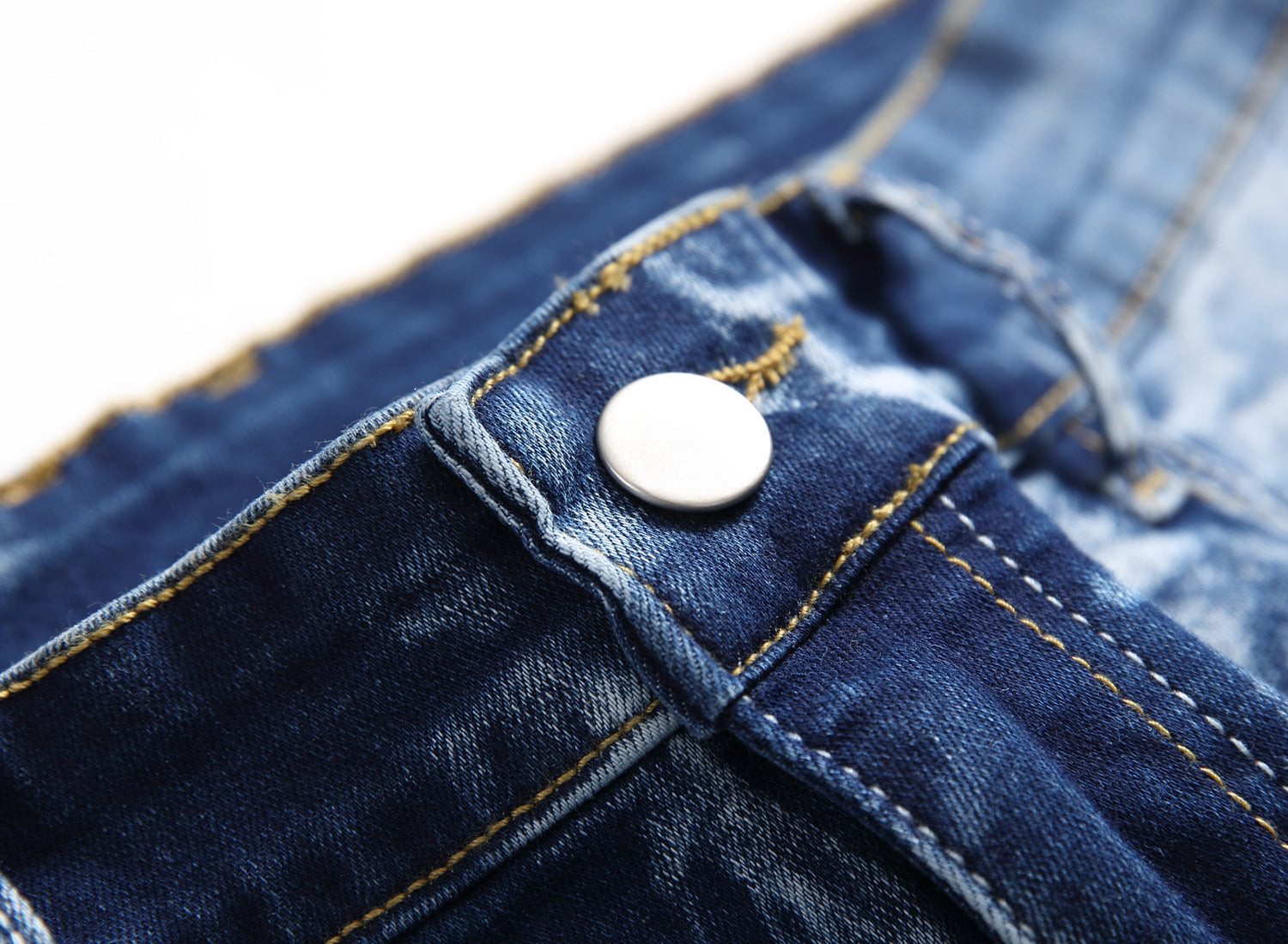 gold button designer stone wash denim jeans men