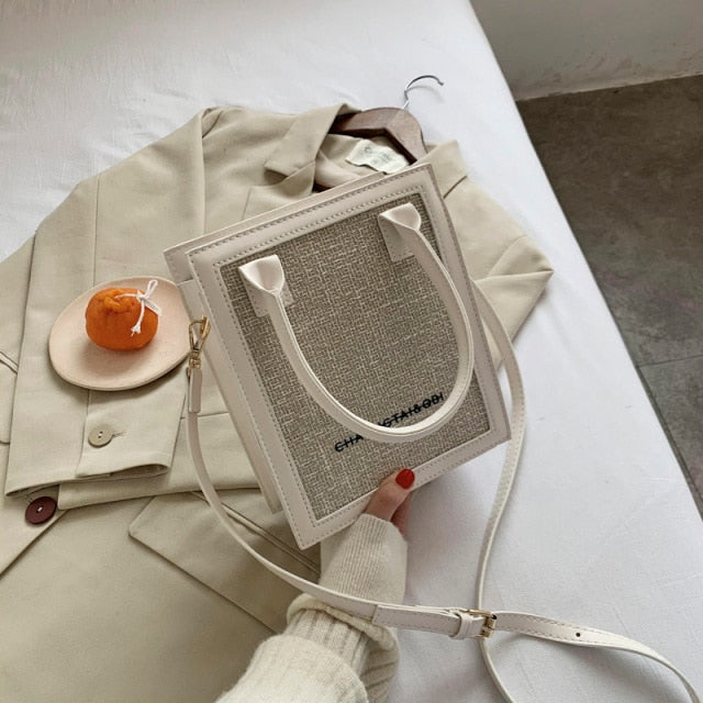 white trim natural beige small luxury handbag