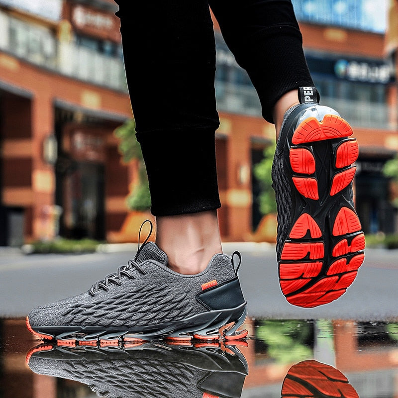 gray and orange air blade sole sneakers
