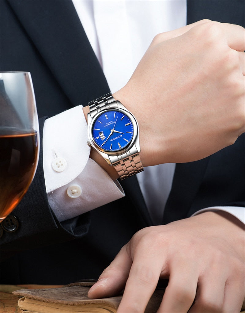 blue face stainless steel watch on wrist