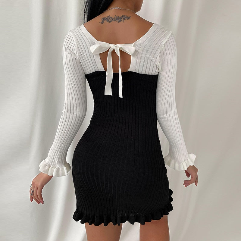 short black dress with long white sleeves