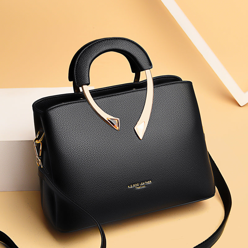 black & gold leather handbag
