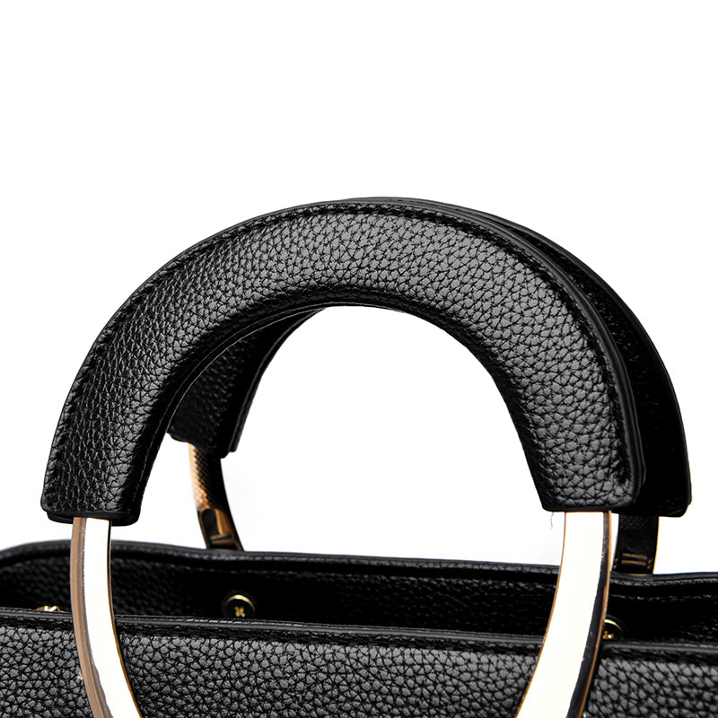gold metal & black leather handbag