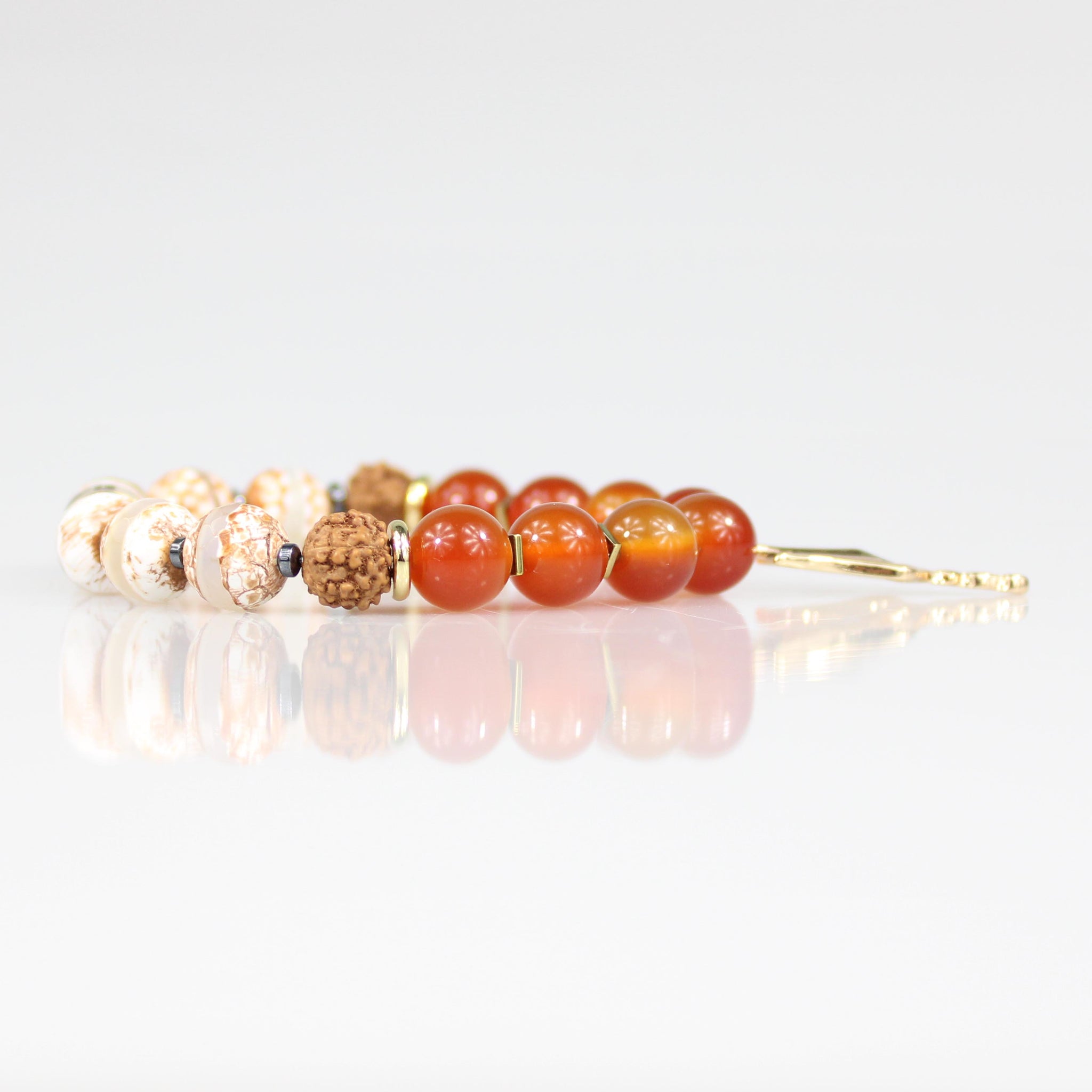 gold trident charm orange carnelian tigerskin rudraksha bead bracelet